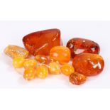 Collection of amber, to include beads and natural form, 569 grams