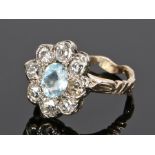 Diamond and aquamarine set ring, the central aquamarine at 1.20 carat with a diamond surround