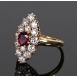 18 carat gold diamond and ruby set ring, the central ruby with a diamond surround, ring size M