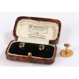 Cased pair of 9 carat gold studs, 1.1 grams, together with a 15 carat gold stud, 1.4 grams