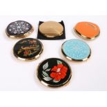 Six Stratton powder compacts, one with foliate and scroll decoration on a blue ground (6)