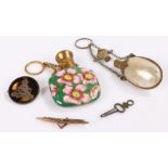 9 carat gold brooch, together with an Artillery badge and two scent bottles, (4)