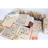 Three stamp albums, collection of loose stamps sorted into envelopes by country, tin of bagged loose