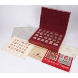 The Empire collection, collection of gilt silver hallmarked stamps housed within the presentation