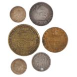 Coins, to include a George III brass Half Crown, two Victorian Three Pence pieces, a gaming token,