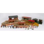 Brimtoy tinplate model railway station with waiting room, two wooden stations, petrol station,