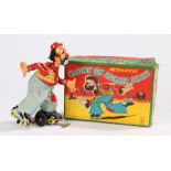 Mechanical clown on roller skates, housed in original box