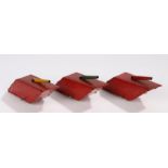Three early 20th Century tinplate toy tanks, in red with a yellow barrel, red and green, (3)
