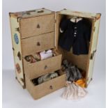 Doll's travel trunk, the trunk opening to reveal four interior drawers and hanging rail, the drawers