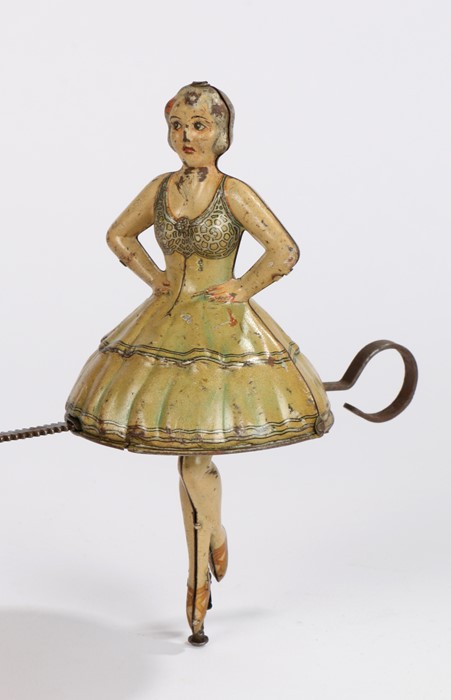 German tinplate ballerina clockwork toy, circa 1920, with an olive green dress, 15cm high