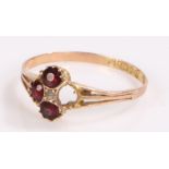 9 carat gold ring, set with garnets, one missing,