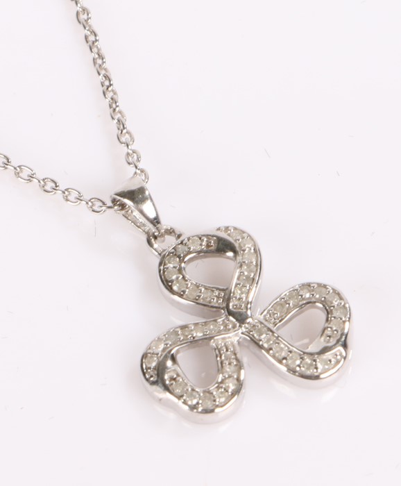 Diamond set bow pendant, on silver with chain