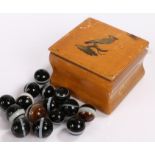 Collection of banded agate beads, housed in a decorative box