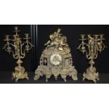 Franz Hermle brass mantel clock garniture, the clock with figure on horseback to the pediment, the