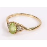 9 carat golf ring, with a central green stone, ring size S