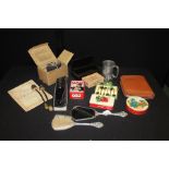 Mixed objects, to include gas mask, advertising tins, Philips War Map, a vanity set, plated