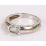 9 carat white gold ring, set with a pale blue stone, together with a 9 carat gold earing catch,