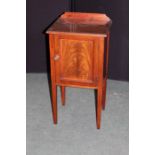 Edwardian mahogany pot cupboard, with a rectangular top and single cupboard door on tapering legs,