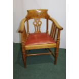 Oak elbow chair, with pierced splat back, chamfered arm supports, red leatherette seat, on square