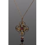 9 carat gold pendant necklace, the pendant set with two pink spinels to a cross design and