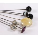 Hat pins, to include a banded agate example, two pairs and an amethyst style example, (7)