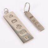 Silver ingot pendant, together with a smaller example, (2)