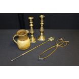 Pair of brass candlesticks, brass tongs and poker, pottery jug (5)