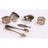 Silver, various dates and makers, to include three napkin rings, sugar tongs, shell form salt, knife