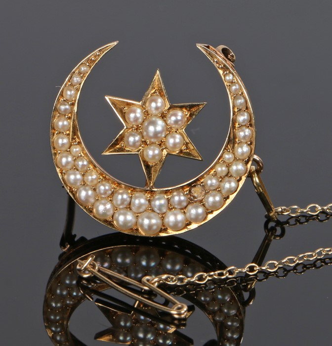 Edwardian pearl set crescent and star brooch, set with pearls all over to the yellow metal brooch,