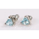 Pair of 9 carat white gold earrings, with blue stones
