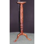 Mahogany torchiere, with a dish top above a leaf carved column and cabriole legs, 129cm high