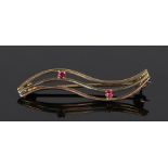 9 carat gold ruby set brooch, with three arched lines set with two rubies, 37mm long