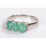 Zambian emerald and white topaz ring, set to a silver shank, ring size N 1/2