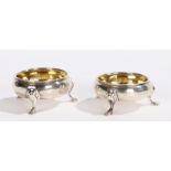 Pair of George III silver salts, London 1762, maker John Muns, of cauldron form with gilt interiors,