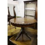 Oriental mahogany and brass inlaid occasional table, with a circular top above a turned base and