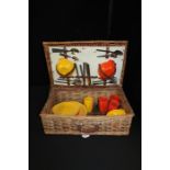 Optima Melaware picnic set, plates, side plates, mugs, bowls and cutlery held in a wicker hamper