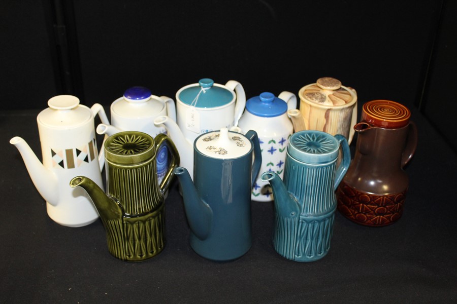 Collection of ceramic coffee pots of various designs and makers, Beswick, Sadler. Price, Winterling,