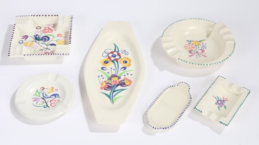 Four Poole pottery ashtrays, two shaped Poole pottery dishes (6)