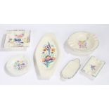 Four Poole pottery ashtrays, two shaped Poole pottery dishes (6)