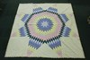 Modern needlework quilt with star design to the centre, 260cm x 260cm