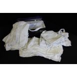 Collection of early 20th Christening gowns, with gloves and socks