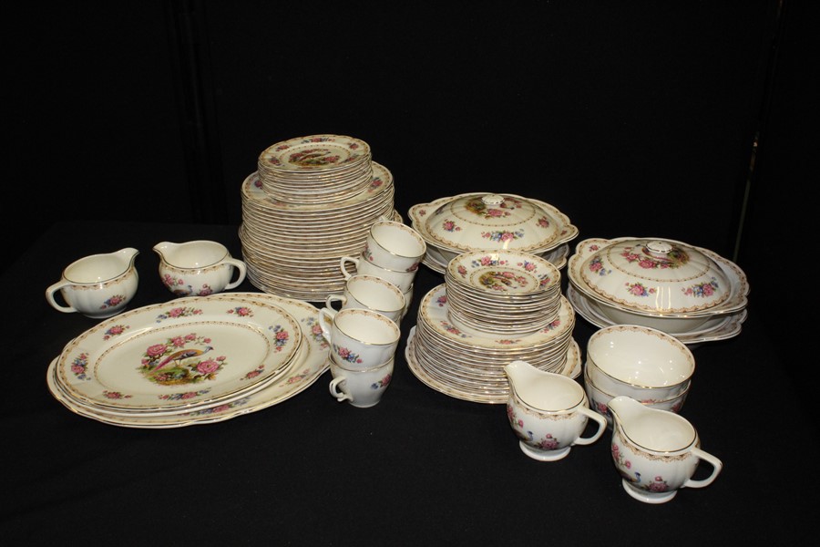 Tams Crown Pottery Norfolk pattern dinner service, decorated with an exotic bird amongst foliage,