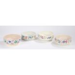 Four Poole pottery fruit bowls, with bird and foliate decoration (4)
