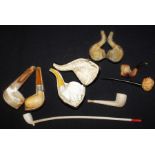Collection of pipes, to include meerschaum examples of a claw, an Arabic man, etc, (qty)