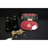 Pair of Dollond binoculars, housed in original leather case, pair of mother or pearl mounted opera
