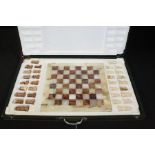 Cased chess set, onyx board and pieces