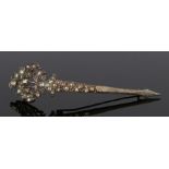 19th Century turban pin, with rose cut stones to the leaf and spear design, 10.5cm long