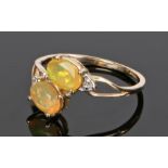 10 carat gold opal set ring, with a pair of opals to the head, ring size Q