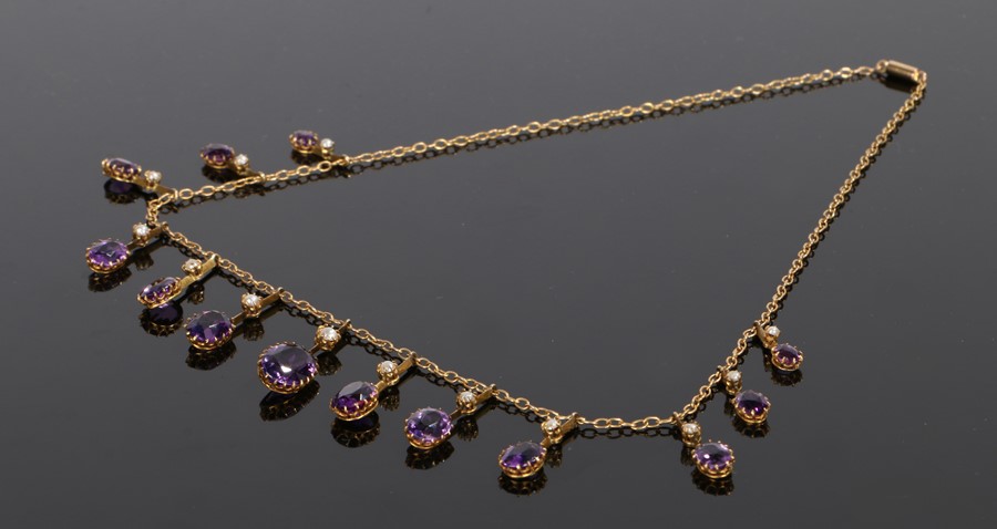 9 carat gold amethyst and pearl set necklace, with a graduated row of drops to the chain link