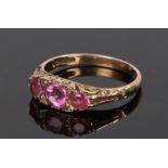 9 carat gold ring, set with three pink stones, ring size O 1/2